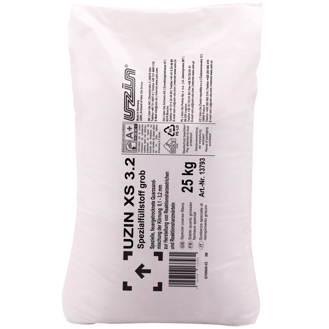 UZIN_Dummy_XS 3.2-25kg_2018-03 Close-up photograph of a large white plastic packaging bag for building materials branded 'UZIN'. The bag displays bold black printed text and technical symbols arranged mostly in a vertical column: the product name and description (special coarse quartz filler), the weight '25 kg', an article number and a barcode. Visible manufacturer and safety markings include an A+ indoor emissions label, a recycling symbol marked '04 PE-LD', directional handling arrows and multiple contact addresses for UZIN in different countries. The bag surface appears slightly wrinkled and glossy, the print is high-contrast and legible; the image is framed against a plain white background and focuses on the central label and marking area.